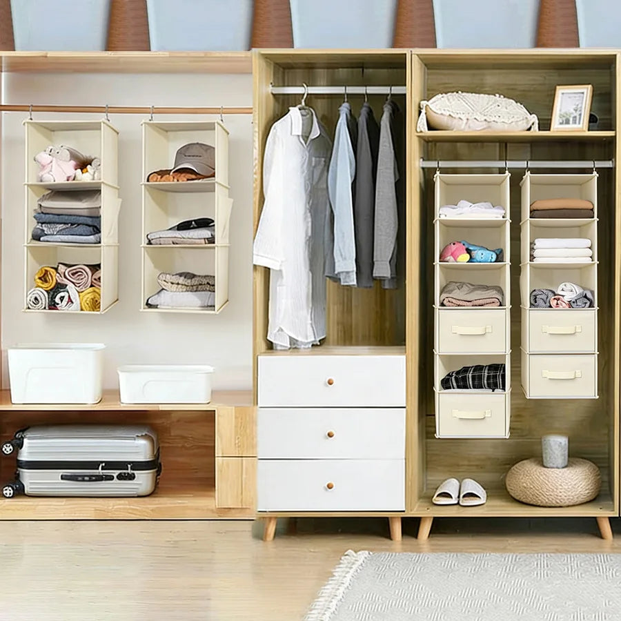 A wooden hanging closet organizer with white drawers and hanging rods for clothing and accessories.