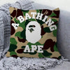 A decorative pillow cover featuring a camouflage pattern with the text ABATHING APE.