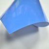A sheet of light blue heat transfer vinyl being displayed at an angle.