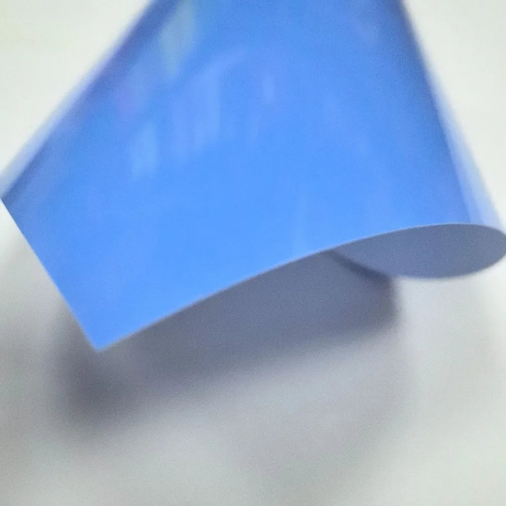 A sheet of light blue heat transfer vinyl being displayed at an angle.