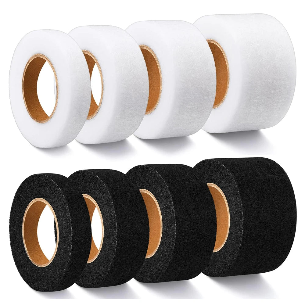Rolls of black and white heavy duty iron-on hemming tape for garments
