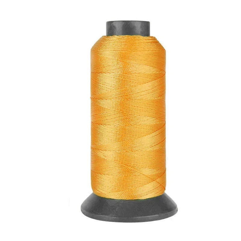 Roll of heavy duty 3-ply nylon sewing thread in orange color