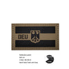 A rectangular beige reflective patch featuring a black banner with the German eagle symbol and text DEU
