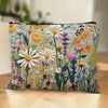 A floral double-sided cosmetic storage pouch featuring white and yellow daisy patterns on a light background.