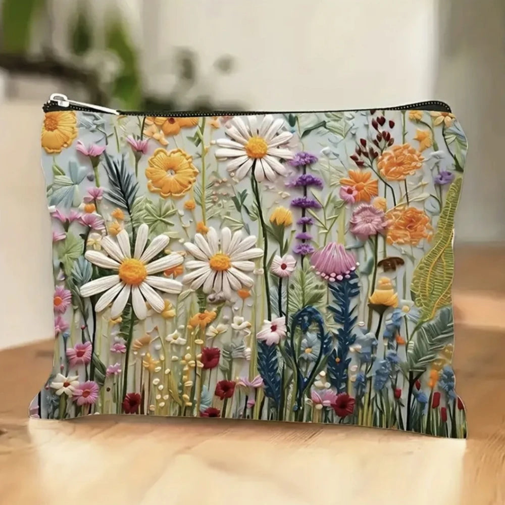 A floral double-sided cosmetic storage pouch featuring white and yellow daisy patterns on a light background.