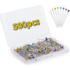A clear plastic box containing 500 glass head straight pins with various colored tips for sewing and crafting.