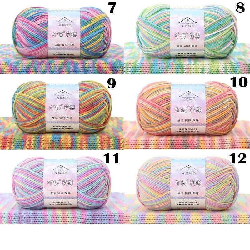 Twelve spools of 4-ply cotton knit yarn in various pastel colors and shades displayed in numbered groups.