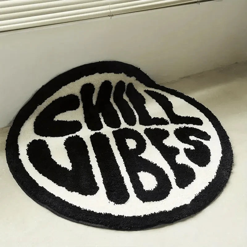 Black and white fuzzy rug with the text SKILL VIBES in large letters