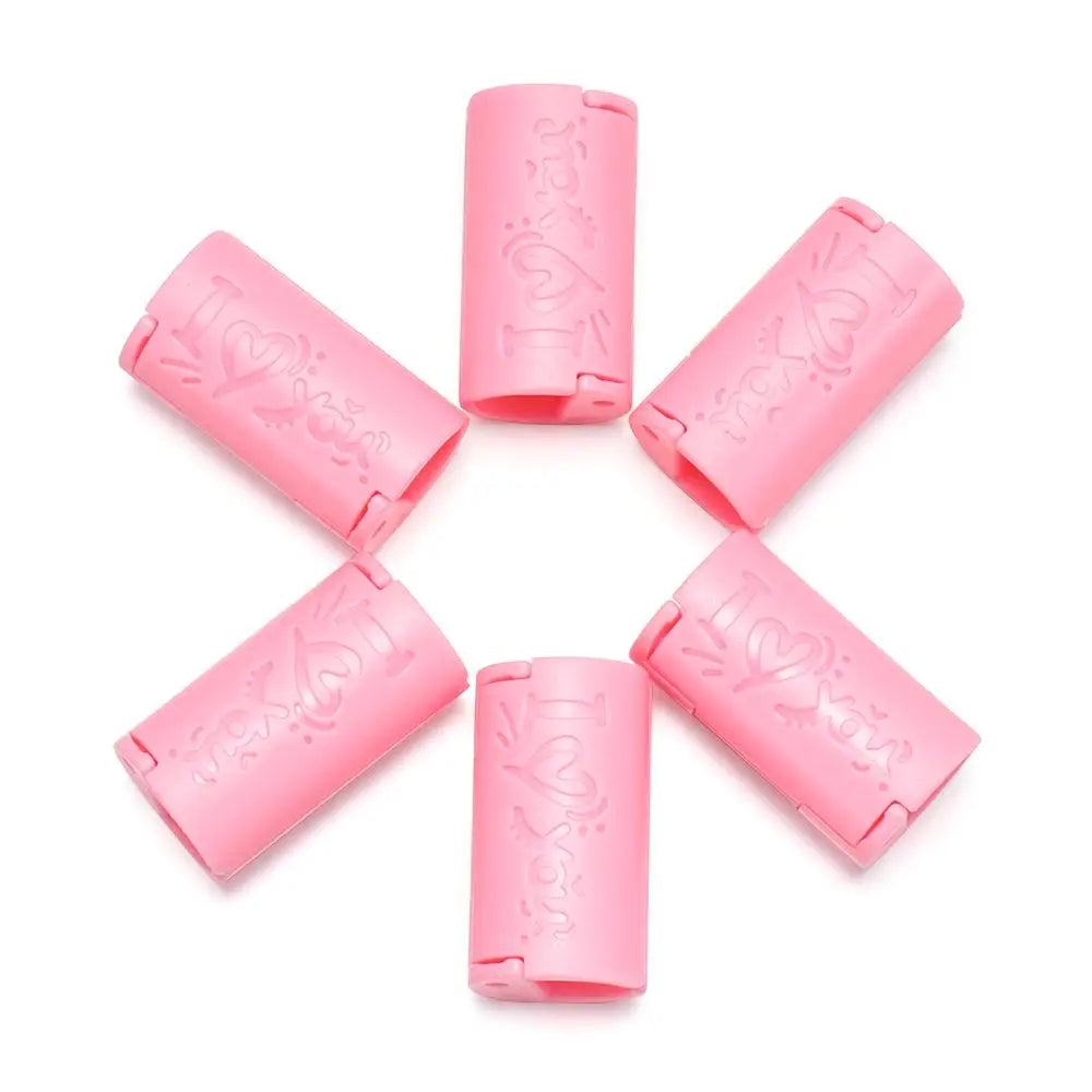 Six pink invisible sheet clips arranged in a star pattern on a white background