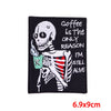 Black embroidered patch featuring a skull design with text that reads Coffee is the only reason I'm still alive