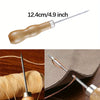 A wooden sewing needle and thread kit with a leather tool used for crafting.