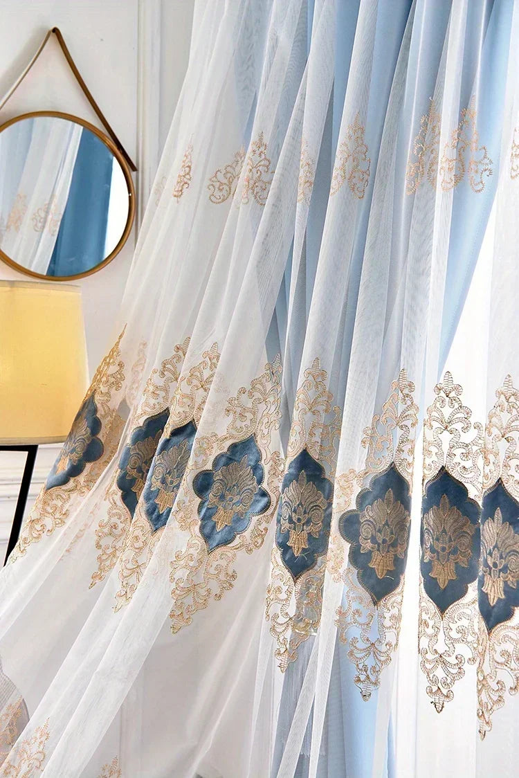 Light blue sheer gauze curtain with gold embroidery and blue accents