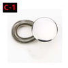 A close-up view of a metal button extender, silver in color.