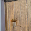 A close-up of a sheer curtain made of vertical crystal beaded strings and tassels.