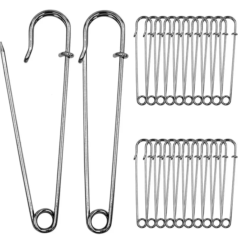 A set of heavy duty stainless steel safety pins, including a long pin and multiple smaller pins.