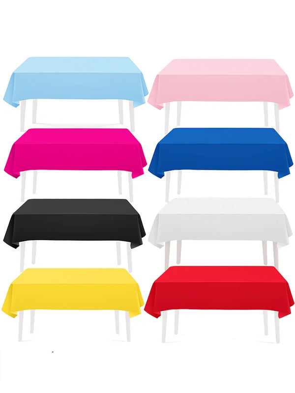 A collection of vibrant solid color rectangle tablecloths in blue, pink, magenta, black, white, yellow, and red.