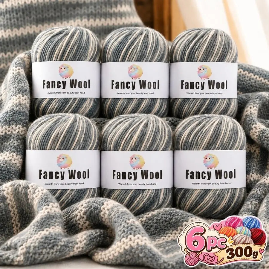 A bundle of three balls of Fancy Wool yarn with labels showing the product name and weight.