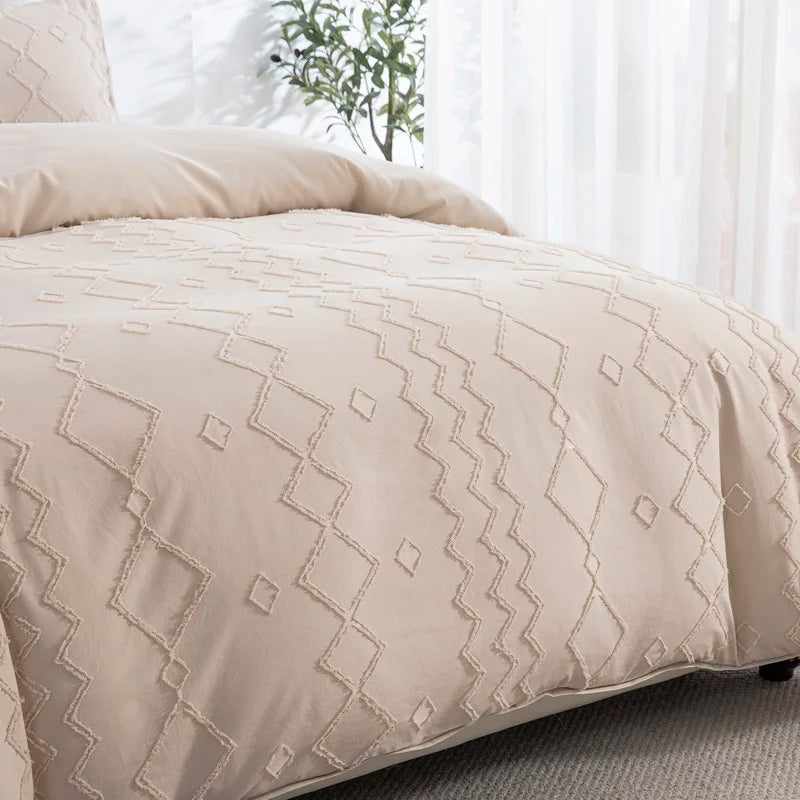 A beige boho tufted microfiber duvet cover set displayed on a bed.