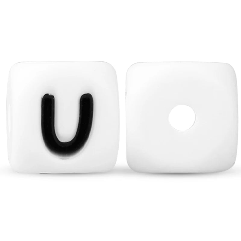 A pair of white silicone alphabet beads, shaped like the letter U and a circle, for DIY jewelry and crafts.