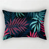 A dark teal and magenta tropical leaf print pillowcase featuring lush green and pink foliage.