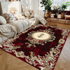 A deep burgundy luxury floral area rug featuring gold accents and traditional patterns.