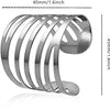 Silver metal napkin rings arranged in a curved, stacked pattern.