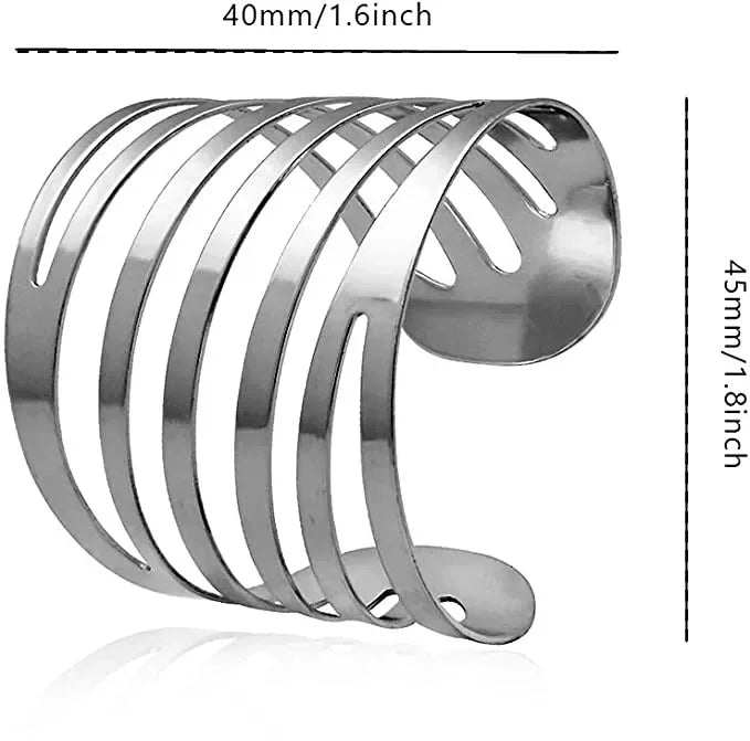 Silver metal napkin rings arranged in a curved, stacked pattern.
