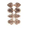 A set of vintage bronze-colored zinc alloy sweater clips featuring intricate floral and scroll designs.