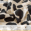 Close-up of beige and black leopard print microfiber fabric showing its ultra-soft, airy, breathable, and skin-friendly textu