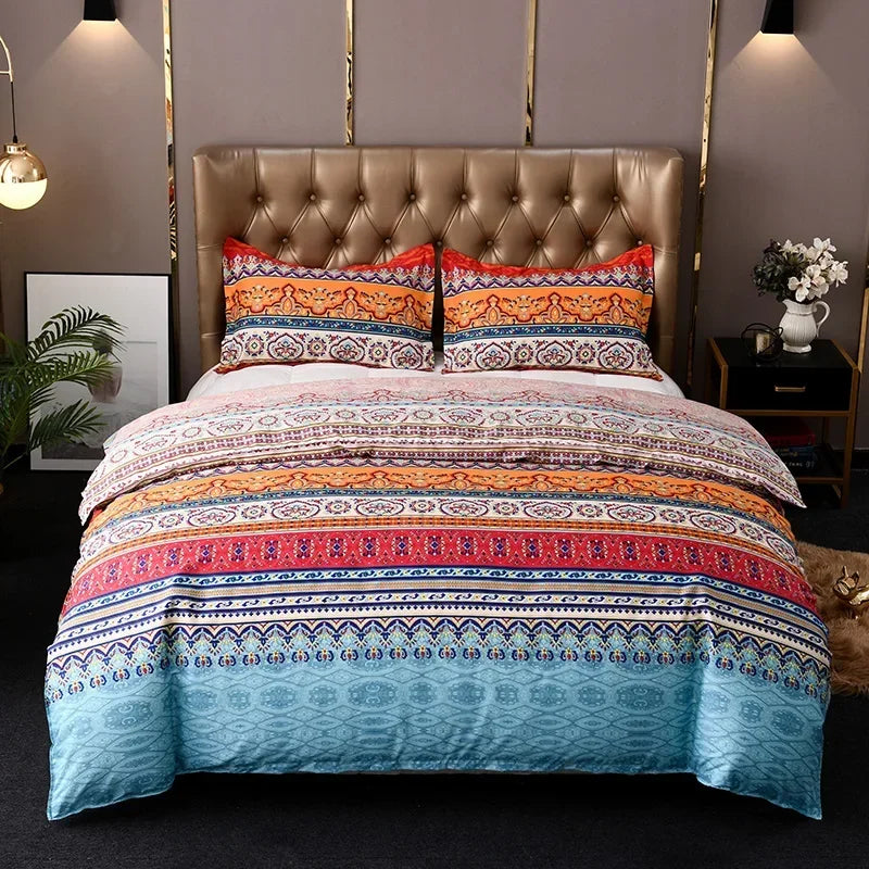 A colorful boho geometric duvet cover set featuring intricate patterns in shades of orange, blue, and pink on a bed.