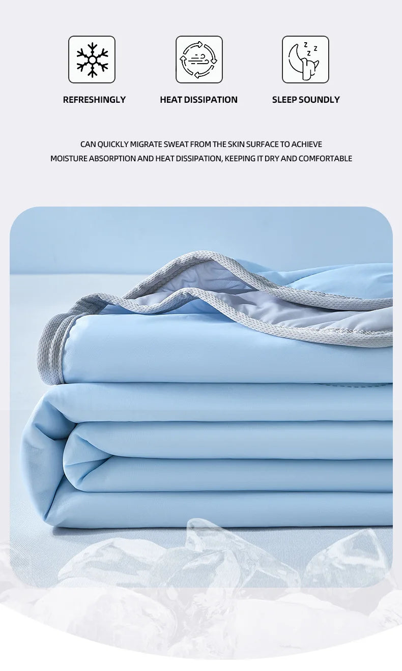 Light blue fabric sheets folded neatly, showing a soft texture and grid pattern.