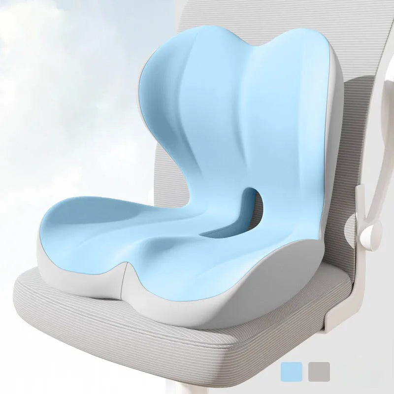 A light blue ergonomic memory foam lumbar seat cushion resting on a gray chair.