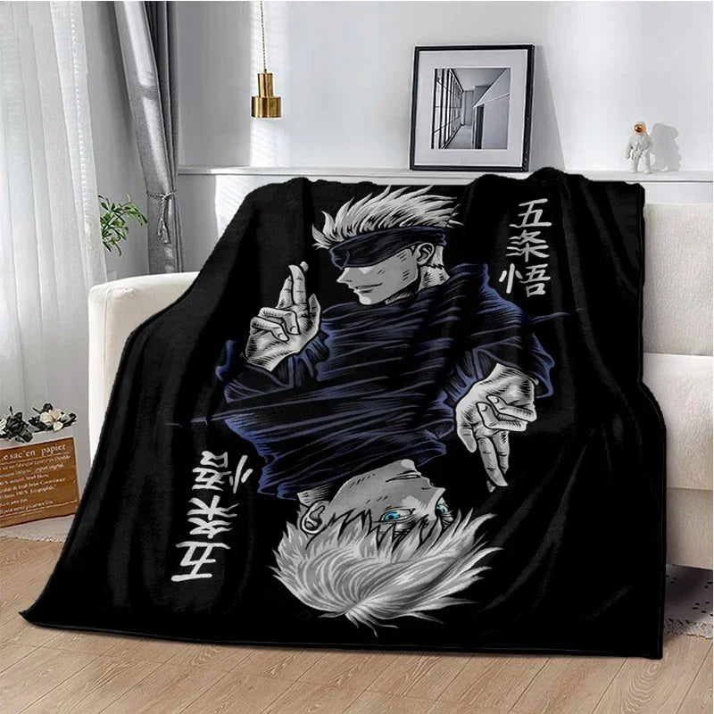 A black throw blanket featuring an illustration of a Jujutsu Kaisen character with white hair and dark clothing.