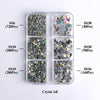 A clear plastic tray containing various sizes of silver and iridescent glass rhinestones categorized by SS6, SS10, SS16, SS20