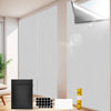 Portable black window shades shown next to a window with a light gray interior wall and a yellow measuring tape.