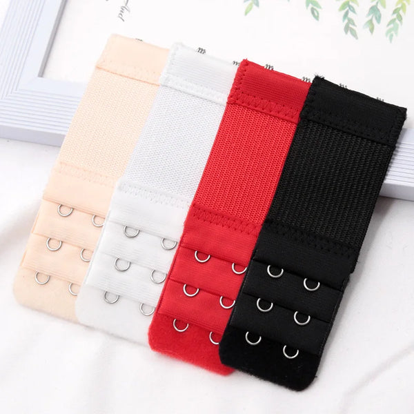 A set of five adjustable bra extender straps in various pastel and dark colors laid out on a white surface.