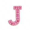 A pink rhinestone letter J patch used for DIY projects.
