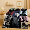 A large print blanket featuring various actors in dramatic black and white portraits.