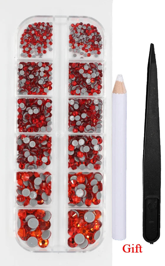 A clear plastic case containing various colored crystal hot fix rhinestones and an applicator tool.
