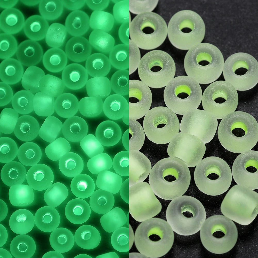 A close-up view of green glow-in-the-dark glass seed beads, some translucent and others opaque.