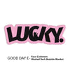 Pink embroidered text LUCKY on a pink fabric item.