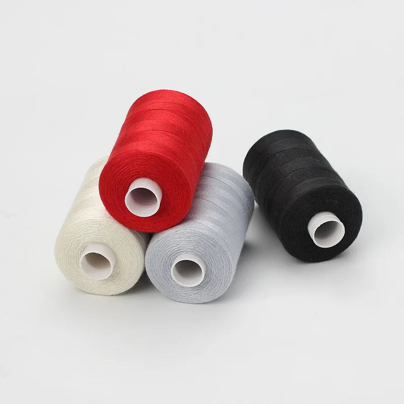 Four spools of polyester thread in red, gray, beige, and black for sewing and quilting
