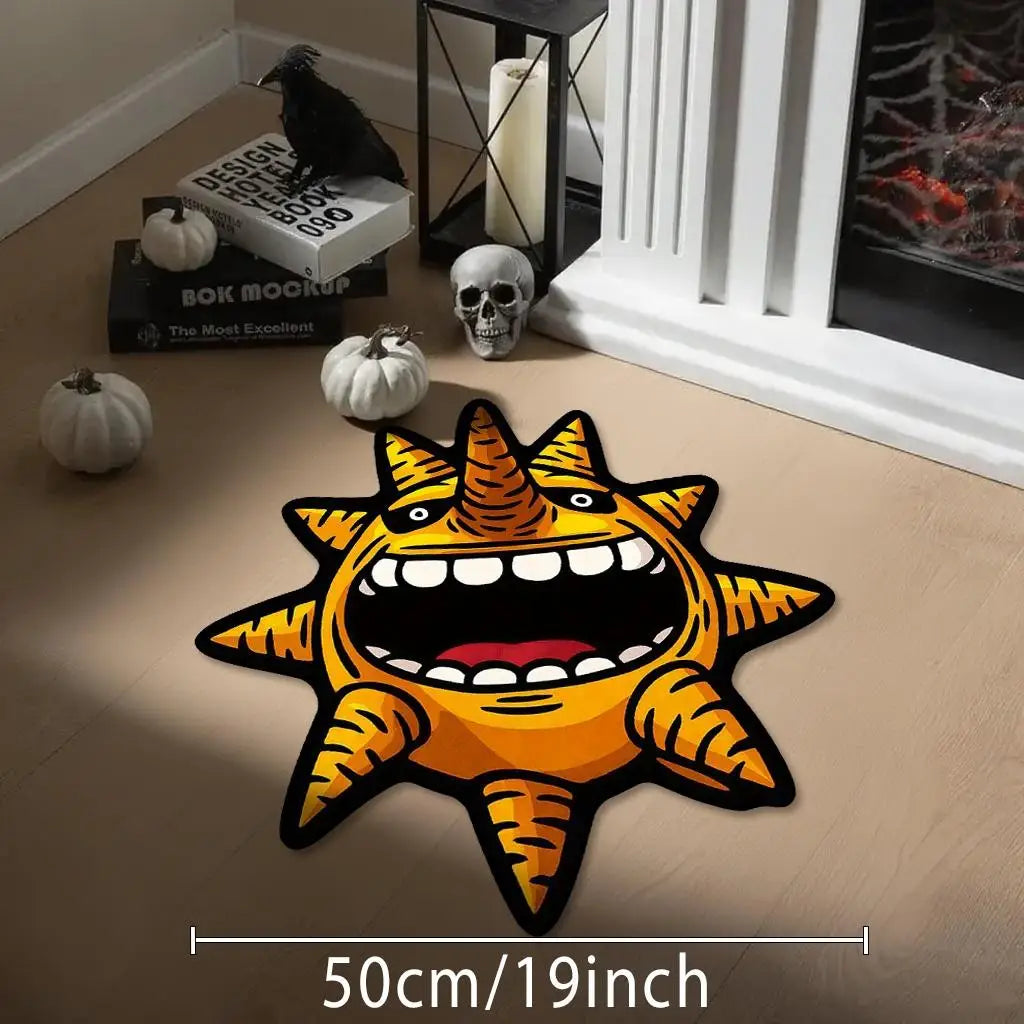 A bright orange cartoon sun monster shaped anti-slip floor mat displayed on a wooden floor.