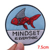 Embroidered patch featuring a red fish silhouette on a light blue background with the text Mindset is everything