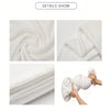 A white cozy plush throw blanket made of soft flannel fleece is shown in various folds and a hand holding it.