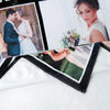 A personalized photo collage is displayed on a black and white blanket, featuring a couple's portrait.