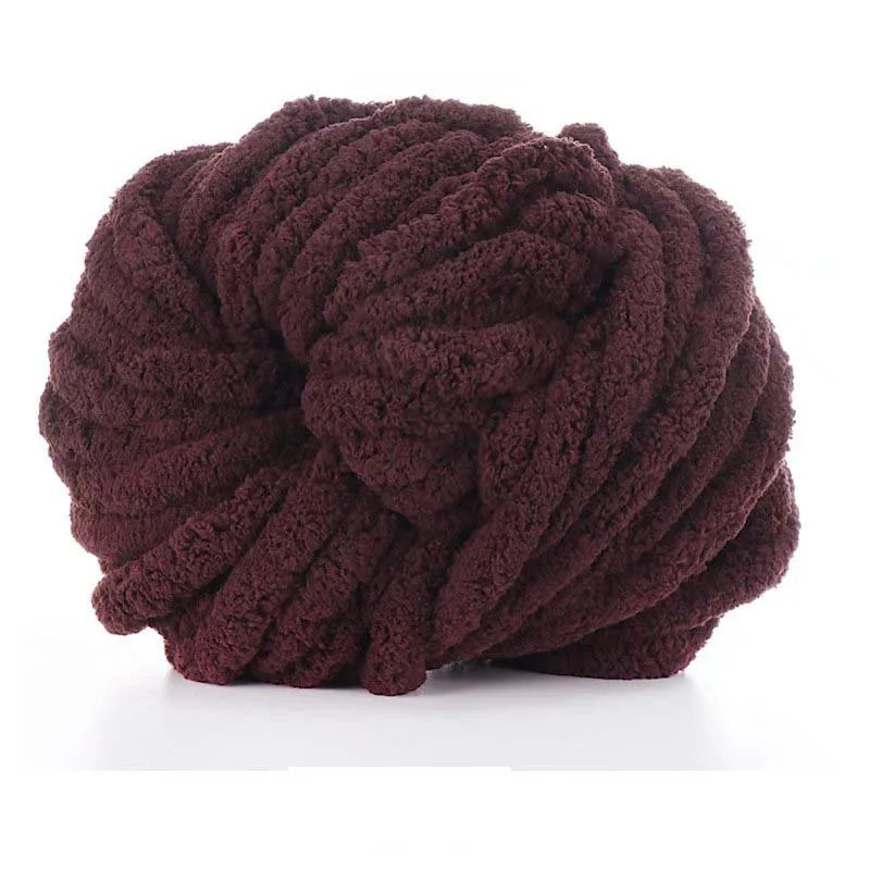 A ball of dark brown chunky acrylic yarn used for knitting and crochet projects.