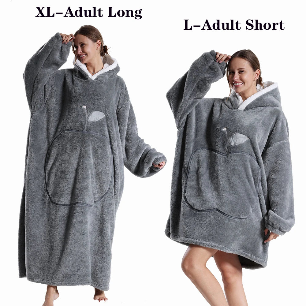 A woman models a gray plush fleece blanket hoodie for adults, showing the long and short versions.