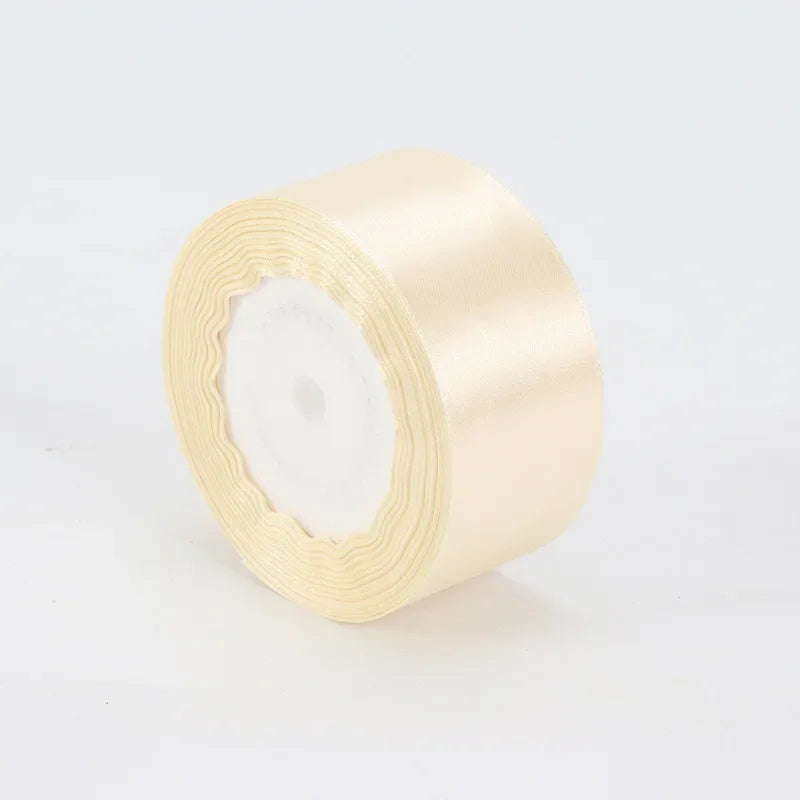 A roll of cream satin ribbon measuring 4cm for crafts and gift wrapping.