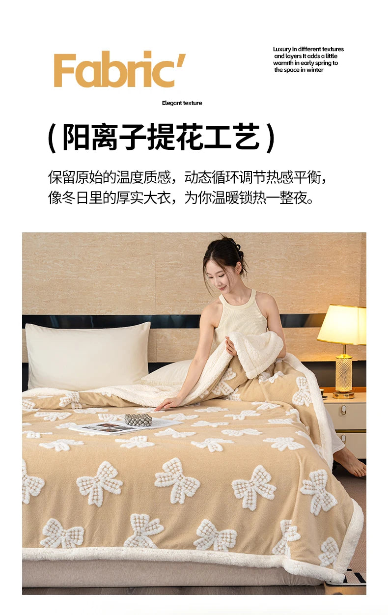 A beige jacquard lambswool blanket is draped over a bed, showing its texture and soft folds.